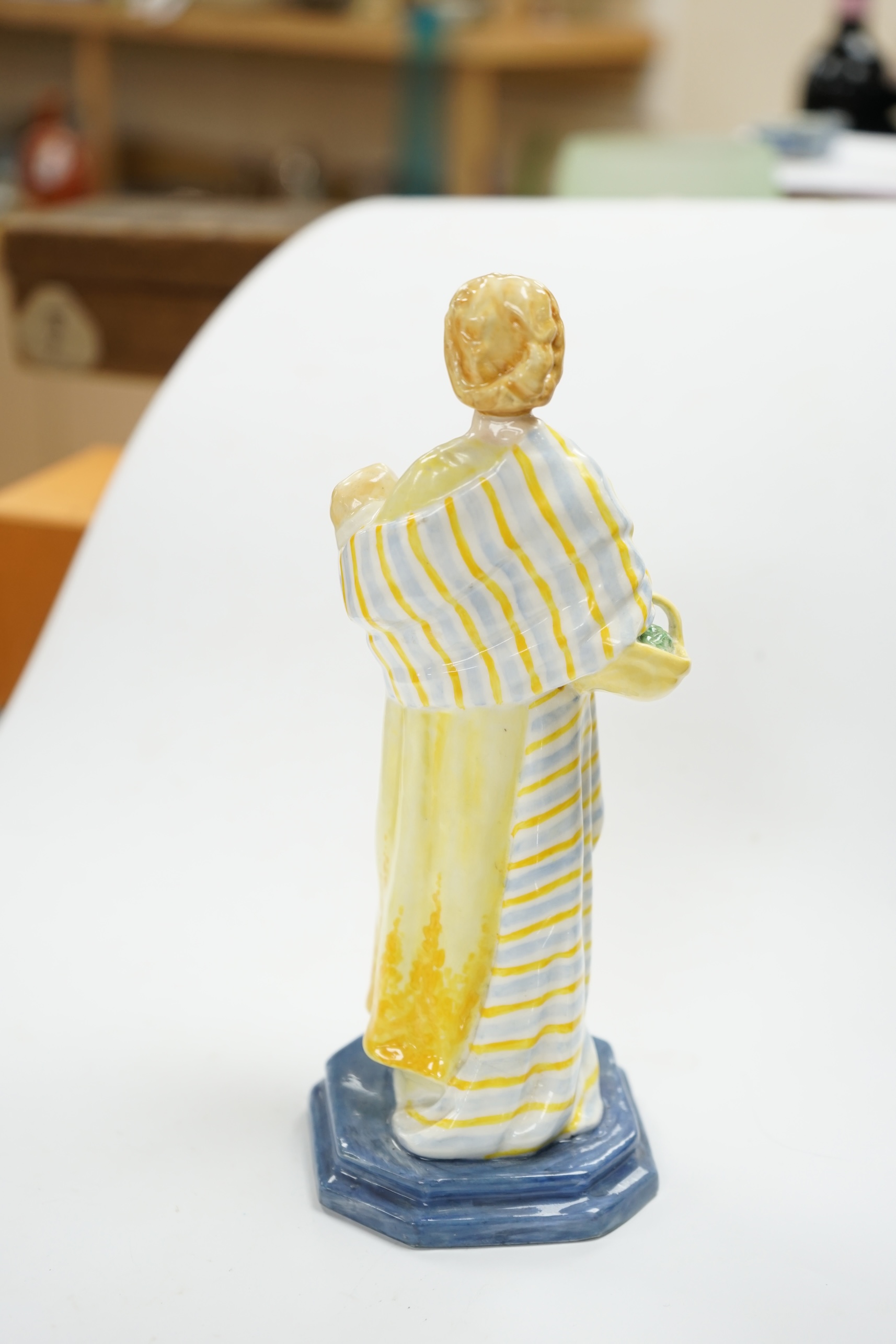 A Royal Worcester figure, 'A Flower girl', modelled by Phoebe Stabler, 20.5cm high. Condition - good